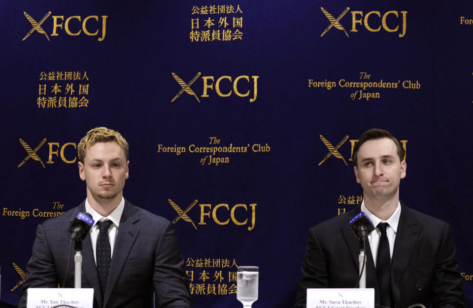 Ukraine's YouTubers Sava Tkachov, right, and his young brother Yan Tkachov attend their news conference at the Foreign Correspondents Club of Japan in Tokyo, Thursday, March 31, 2022. (AP Photo/Shuji Kajiyama)