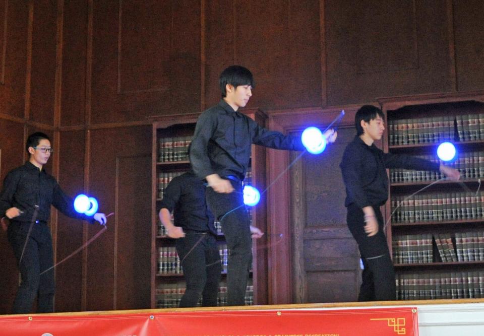 Greater Boston Chinese Cultural Aassociation Huaxin School of Arts members perform a yo-yo dance with giant illuminated yo-yos during the Lunar New Year Festival in Braintree, Sunday, Jan. 15, 2023. Tom Gorman/For The Patriot Ledger 