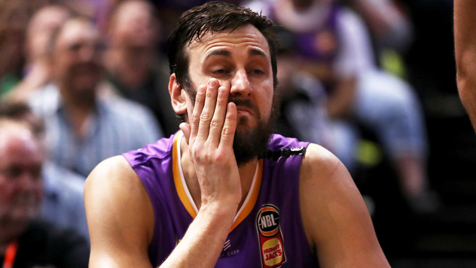 Andrew Bogut looks dejected on the bench for the Sydney Kings.