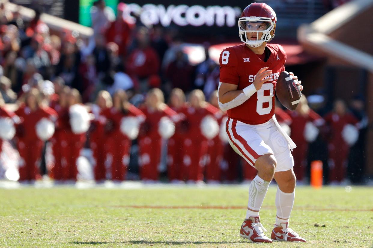 Oklahoma Sooners quarterback Dillon Gabriel (8) drops back to pass during a college football game between the University of Oklahoma Sooners (OU) and the TCU Horned Frogs at Gaylord Family-Oklahoma Memorial Stadium in Norman, Okla., Friday, Nov. 24, 2023. Oklahoma won 69-45.