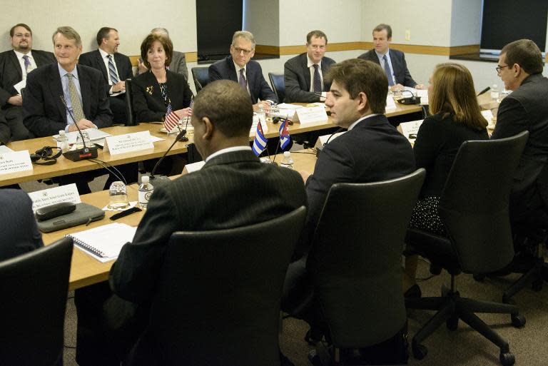 US Assistant Secretary of State for the Western Hemisphere Roberta Jacobson (2nd L) sits across from the Cuban delegation during a meeting at the US State Department on May 21, 2015 in Washington, DC