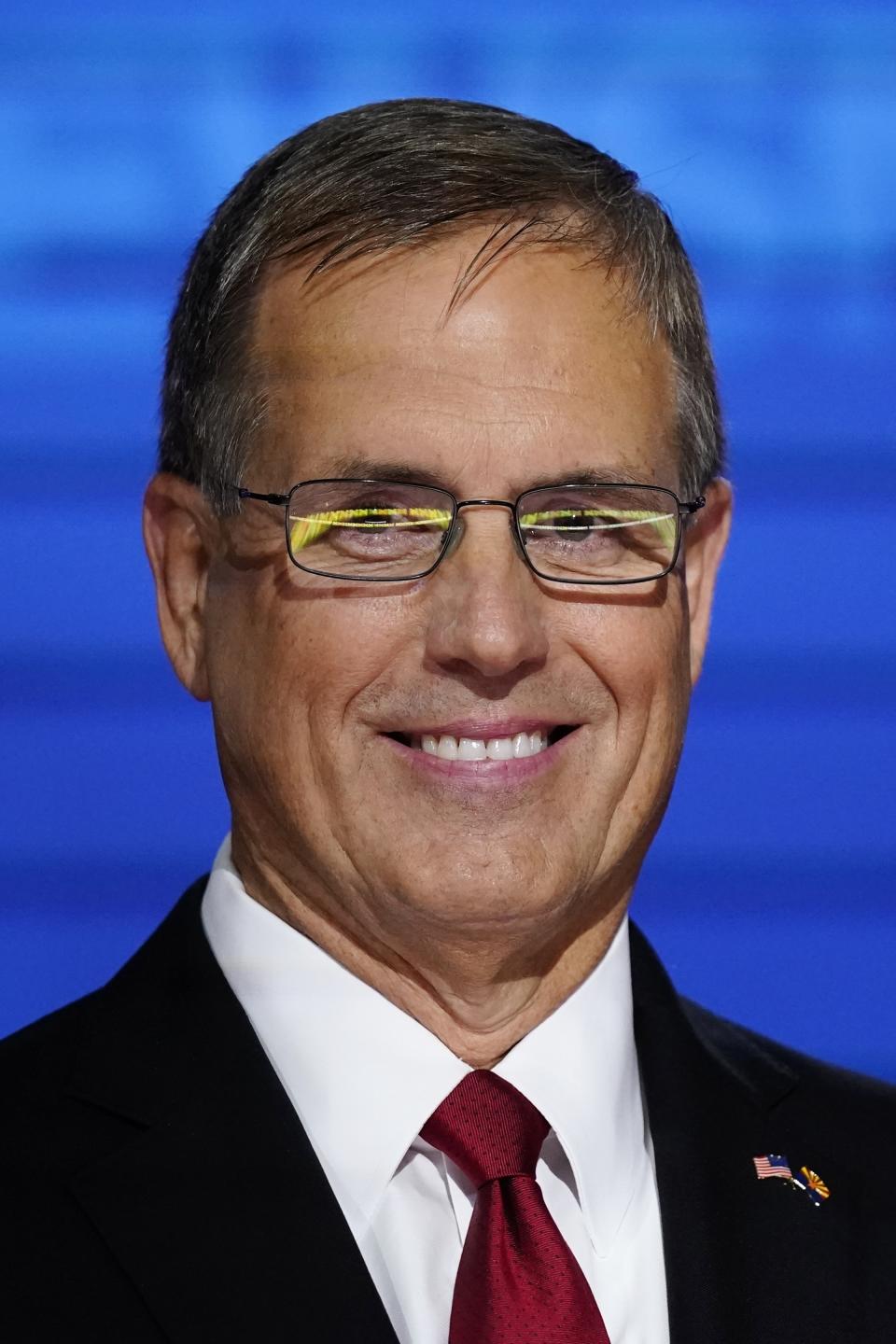 FILE - Arizona Republican U.S. Senate candidate Jim Lamon poses for a photograph prior to the Arizona Republican Senate primary debate hosted by Newsmax at the Madison Center for The Arts, July 13, 2022, in Phoenix. Lemon, one of 11 Republicans in Arizona who submitted a document to Congress falsely declaring Donald Trump had beaten Joe Biden in the state during the 2020 presidential election, was charged Wednesday, April 24, 2024, with conspiracy, fraud and forgery, marking the fourth state to bring charges against "fake electors." (AP Photo/Ross D. Franklin, File)