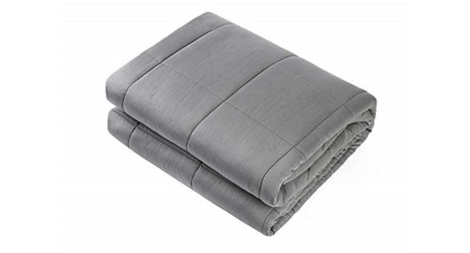 This 15lb weighted blanket with premium glass beads was designed to relax by simulating the feeling of being held or hugged (Photo: Amazon)