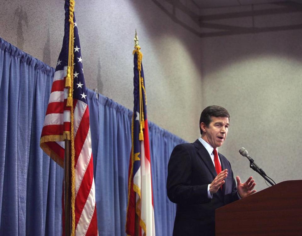 N.C. Attorney General Roy Cooper addresses the media in during a press conference at the RBC Center in August 2007, in which Cooper said that he is dropping the remaining charges against Duke lacrosse players.