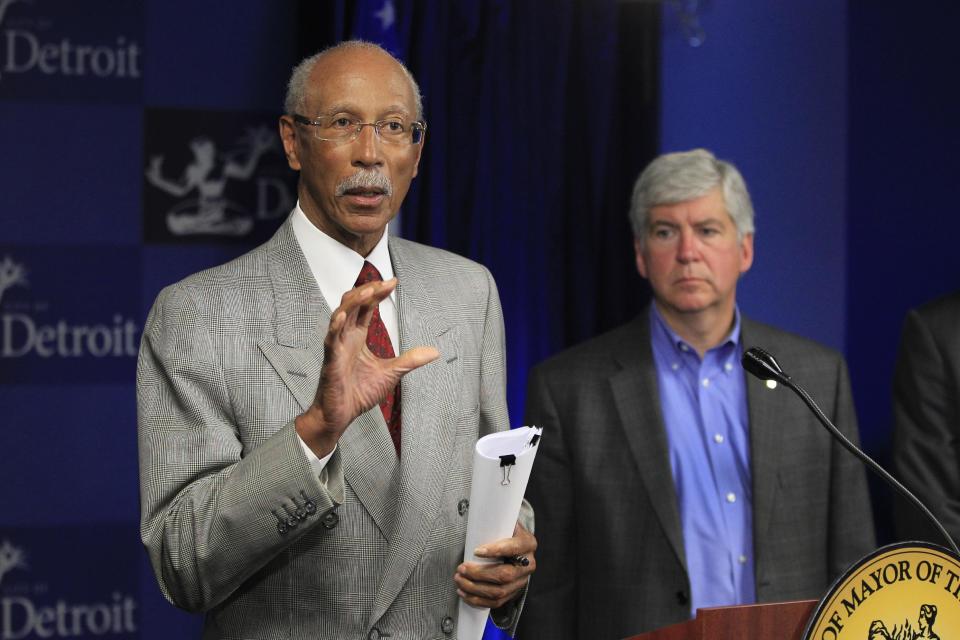 Detroit Mayor Dave Bing, left, and Gov. Rick Snyder address the media during a news conference in the mayor's office in Detroit, Monday, June 4, 2012. City and state officials, along with a cadre of influential business leaders, will spend the next two months coming up with answers posed by federal Transportation Secretary Ray LaHood on a proposed Detroit light rail project. (AP Photo/Carlos Osorio)