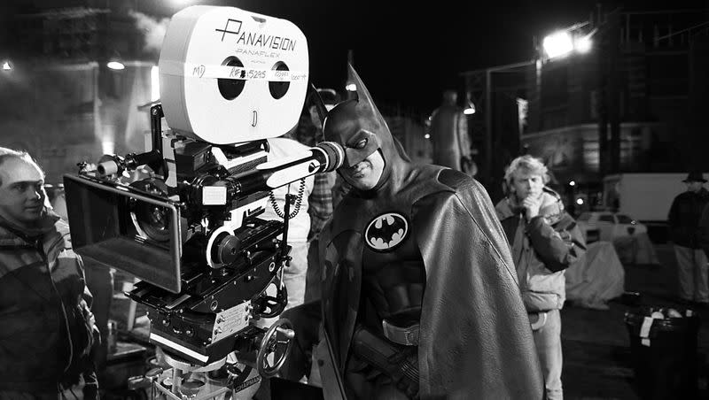 American actor Michael Keaton tries the view from behind the camera, during the filming of “Batman,” in 1989.