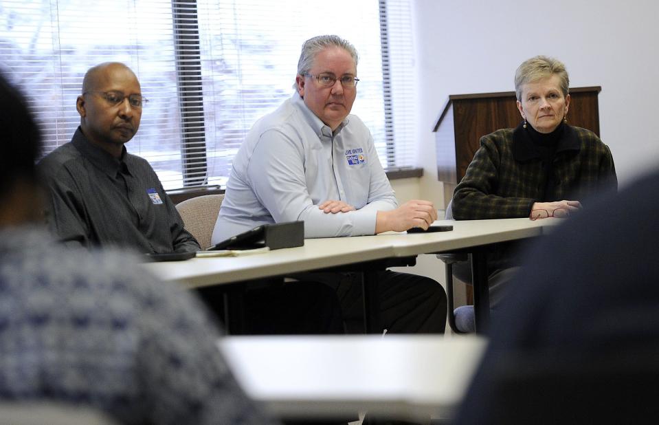 This is a Jan. 12, 2015, file photo at the United Way of Erie County of, from left: Ron Oliver, vice president of labor relations; Bill Jackson, president; and Cheryl Bates, the United Way's program director for the Erie Free Taxes program.