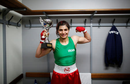 Iranian boxer Sadaf Khadem poses in the locker room after winning the fight against French boxer Anne Chauvin during an official boxing bout in Royan, France, April 13, 2019. REUTERS/Stephane Mahe