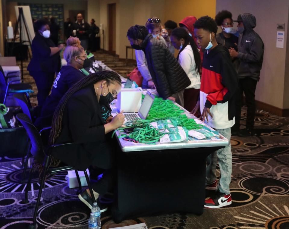 Alexandria Payne registers Darrell Vaughn for the Detroit Public Safety & DPD teen mental health summit Saturday, May 7, 2022 at the Fort Pontchartrain in Detroit.