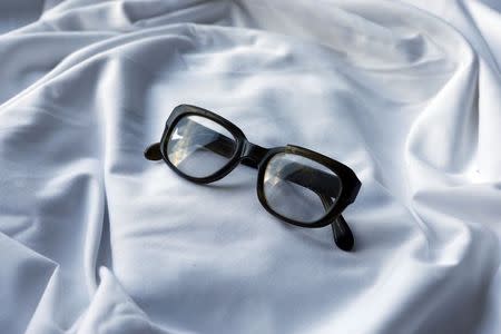 A pair of glasses which were discovered in Seamus Ruddy's Paris apartment after he went missing are displayed in his sister Anne Morgan's house in Newry, County Down November 4, 2014. REUTERS/Cathal McNaughton