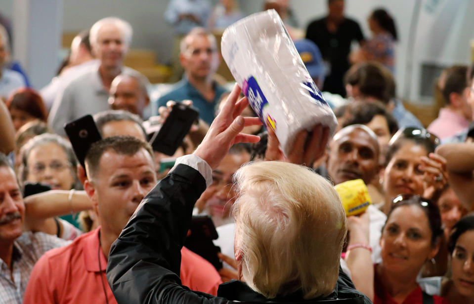 <p>President Donald Trump throws rolls of paper towels to a crowd of local residents affected by Hurricane Maria as he visits a disaster relief distribution center at Calgary Chapel in San Juan, Puerto Rico, Oct. 3, 2017. (Photo: Jonathan Ernst/Reuters) </p>