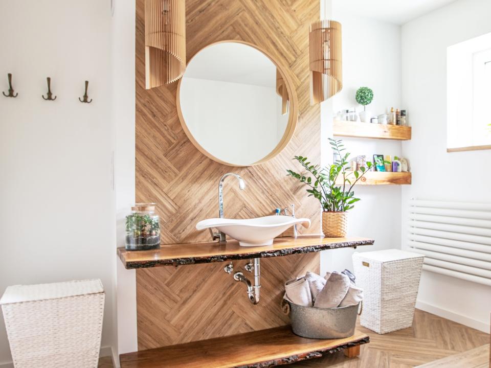 Wooden vanity area with porcelain sink