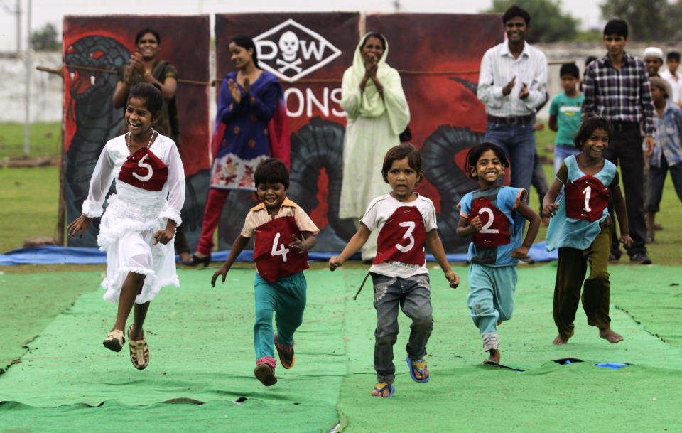 Indian children suffering with birth defects compete in a 25 Meters sprint event during a "Special Olympics" held by the survivors of the deadly 1984 Bhopal gas leak in an effort to shame Olympic sponsor Dow Chemical Co. on the eve of the London Games in Bhopal, India, Thursday, July 26, 2012. Survivors say Dow owes them compensation for the world's worst industrial disaster and have campaigned to have the chemical giant dropped as a sponsor of the Olympics. Dow says it has no liability because it bought the company responsible for the plant more than a decade after the cases had been settled. (AP Photo/Altaf Qadri)