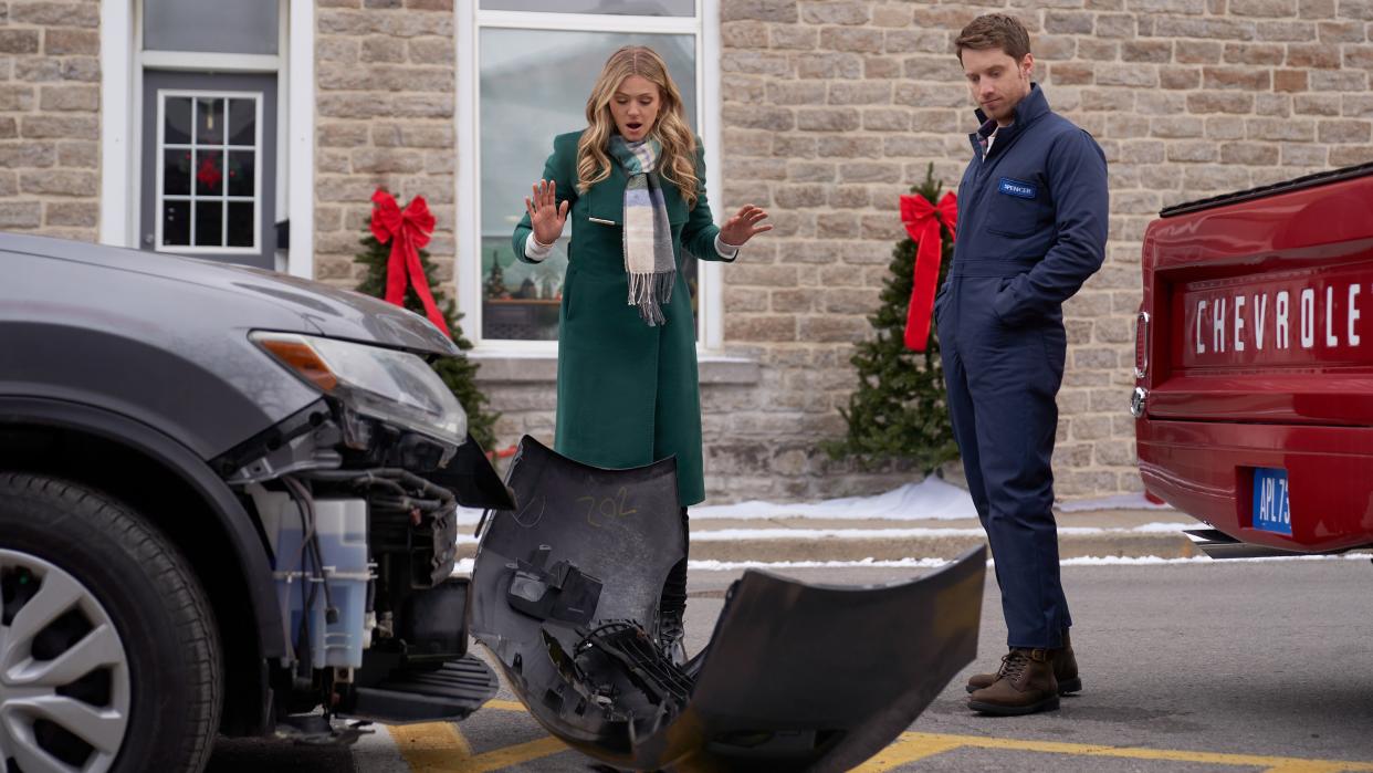  Rebecca Dalton and Jonathan Keltz look at a broken bumper in Christmas by Design. 
