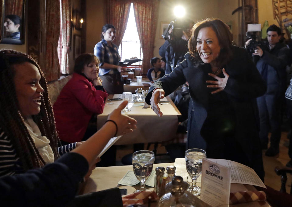 Democratic presidential candidate Sen. Kamala Harris, D-Calif., greets patrons at the Common Man Restaurant in Concord, N.H., Monday, Feb. 18, 2019. (AP Photo/Elise Amendola)