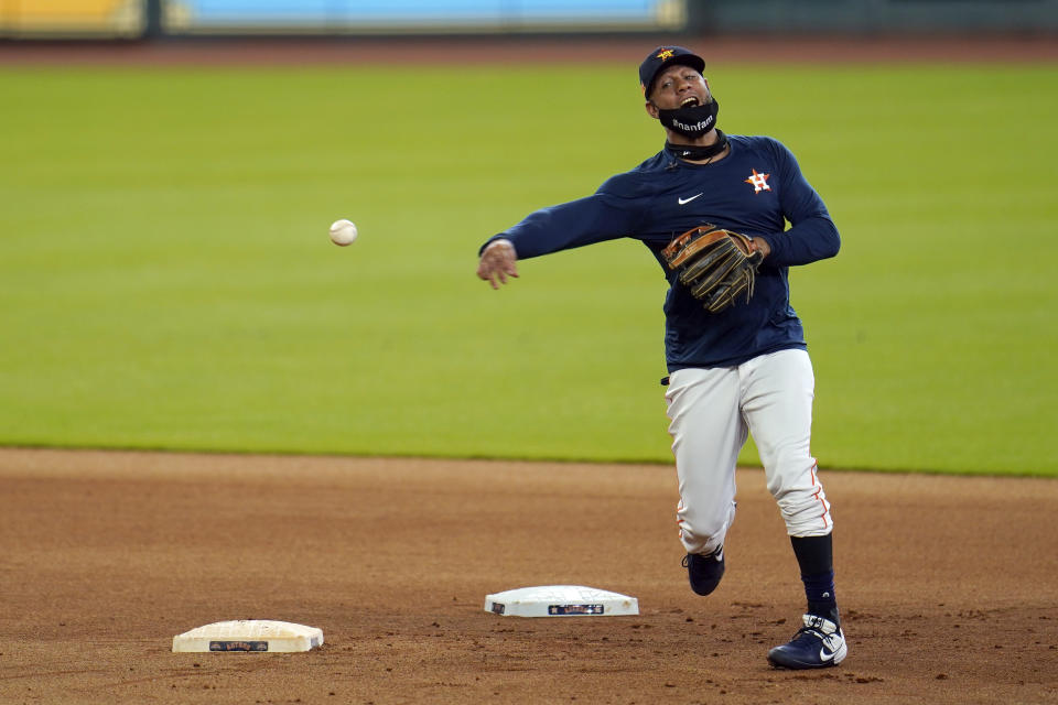 Houston Astros first baseman Yuli Gurriel runs through a drill during a baseball practice at Minute Maid Park, Sunday, July 5, 2020, in Houston. (AP Photo/David J. Phillip)