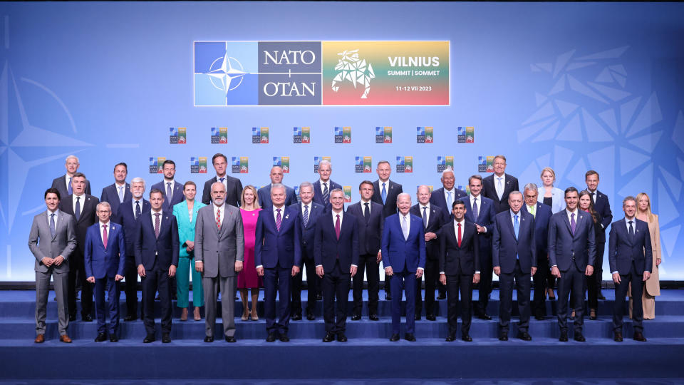 Leaders from NATO member countries pose for an official photo on the opening day of the annual NATO Summit.
