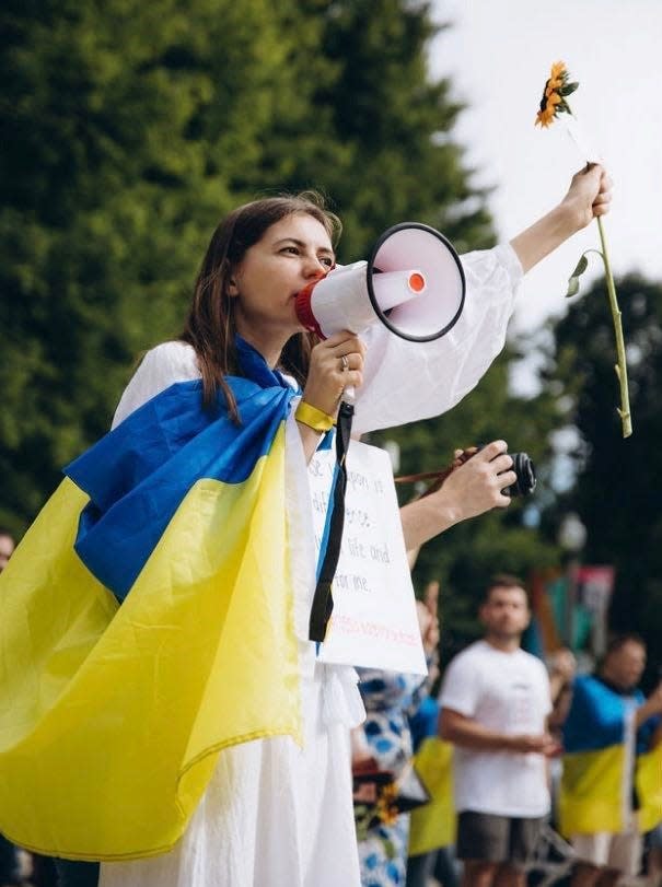 Liliia Popovych, 30, speaks at a protest against the Russian war in Ukraine in downtown Chicago on Aug. 21, 2022.