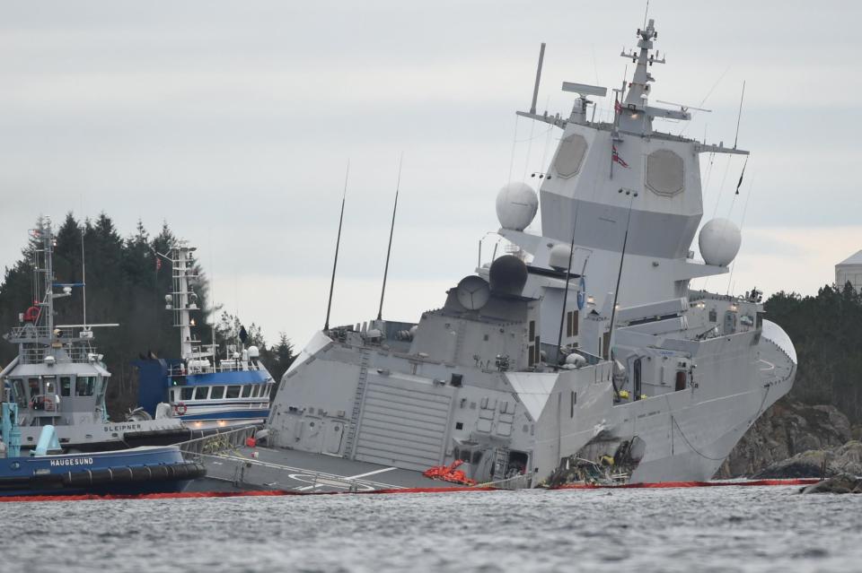 Warship at risk of sinking to bottom of Norwegian fjord after colliding with oil tanker