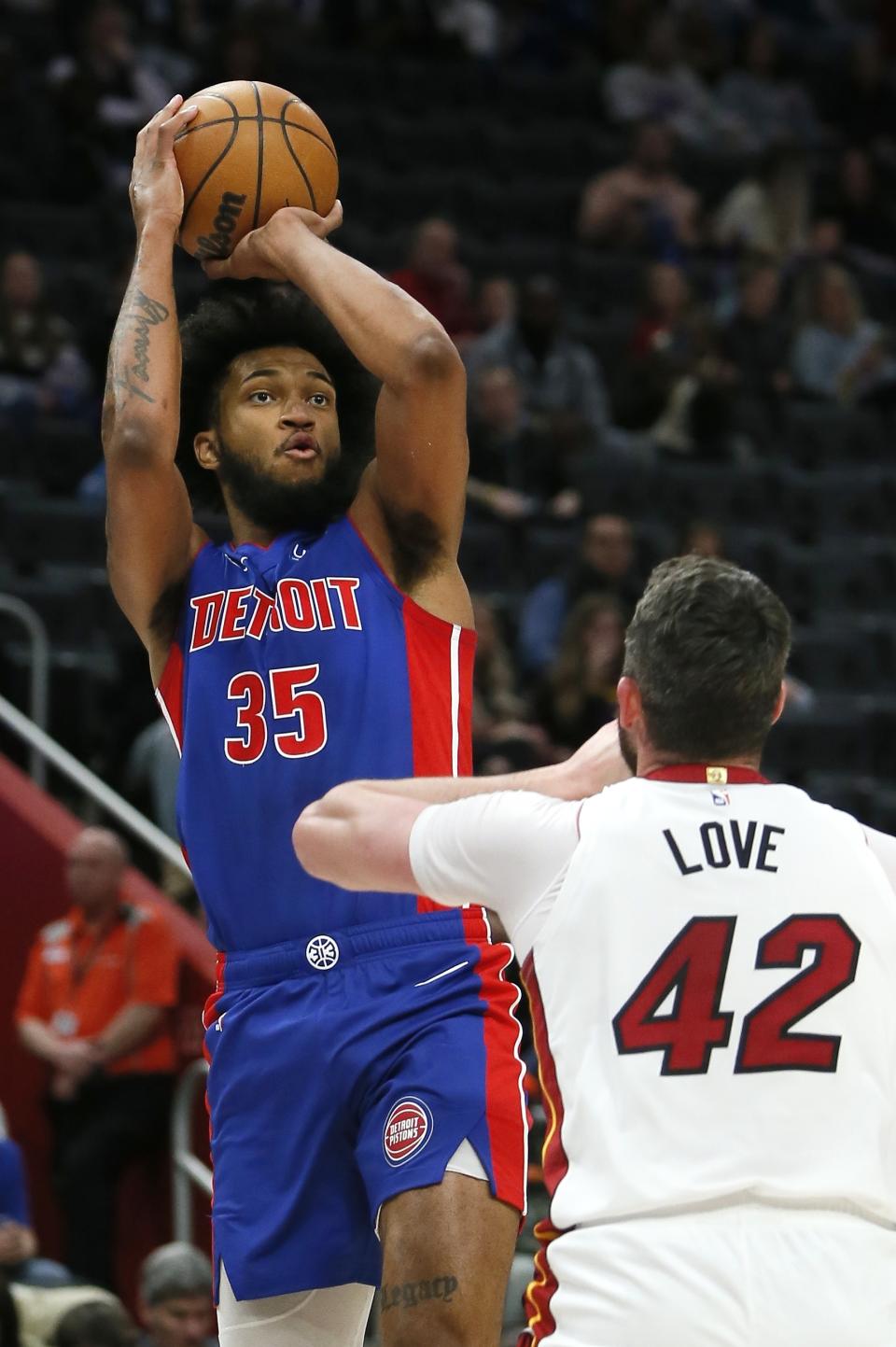 Detroit Pistons forward Marvin Bagley III (35) shoots against Miami Heat forward Kevin Love (42) during the first half of an NBA basketball game Sunday, March 19, 2023, in Detroit. (AP Photo/Duane Burleson)