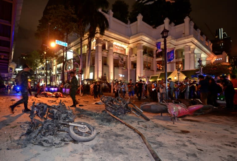 Thai soldiers inspect the scene after a bomb exploded outside a religious shrine in central Bangkok late on August 17