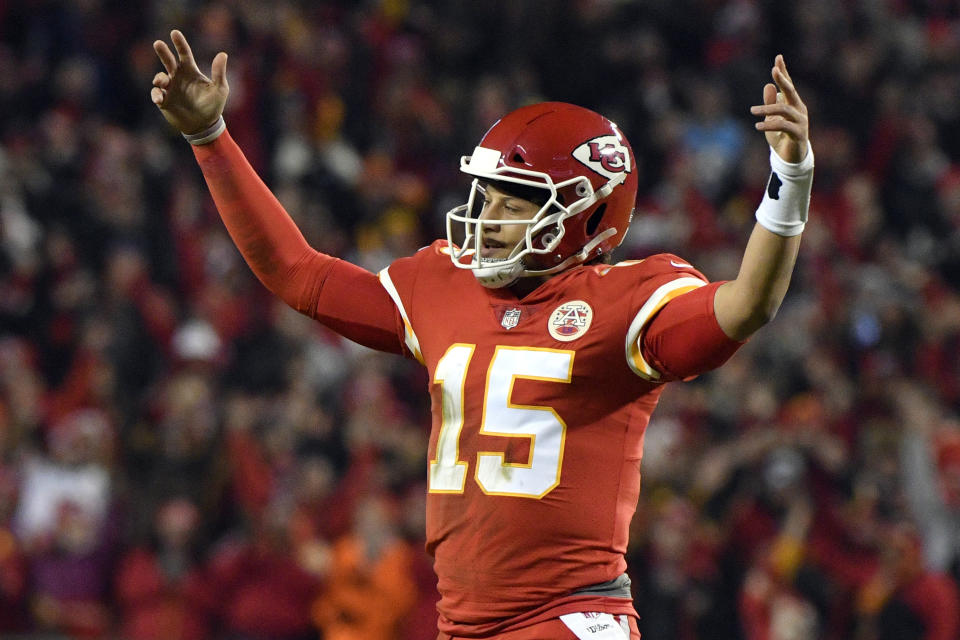 Kansas City Chiefs quarterback Patrick Mahomes (15) reacts after running back Darrel Williams scored a touchdown during the first half of an NFL football game against the Los Angeles Chargers in Kansas City, Mo., Thursday, Dec. 13, 2018. (AP Photo/Ed Zurga)