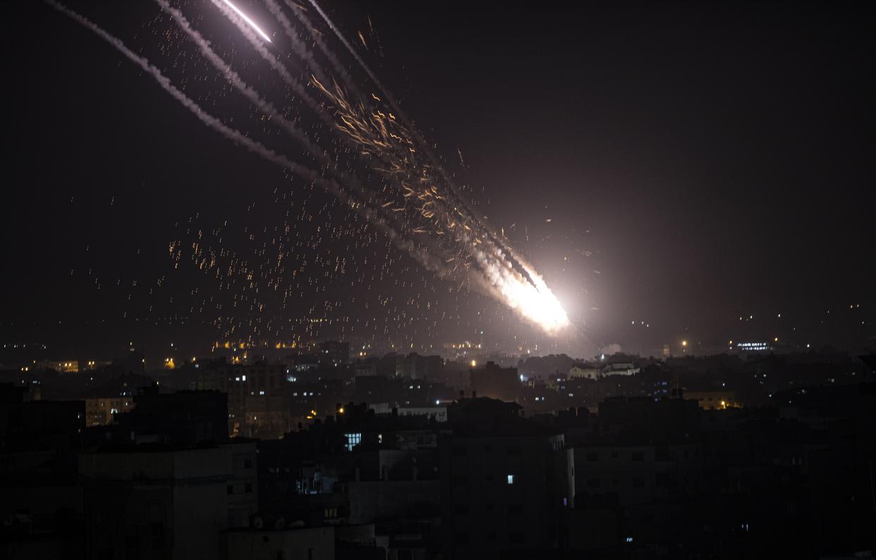 Rockets are launched from the Gaza Strip towards Israel on Monday, May. 10, 2021. Hamas militants fired dozens of rockets into Israel on Monday, including a barrage that set off air raid sirens as far away as Jerusalem, after hundreds of Palestinians were hurt in clashes with Israeli police at a flashpoint religious site in the contested holy city.