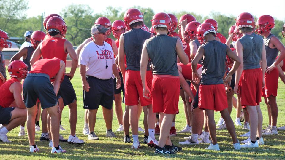 Head coach Denney Faith fathers his players after a first round of agility drills, challenging them to work hard and promising them that Lions coaches will work them hard to prepare for the 2023 season.