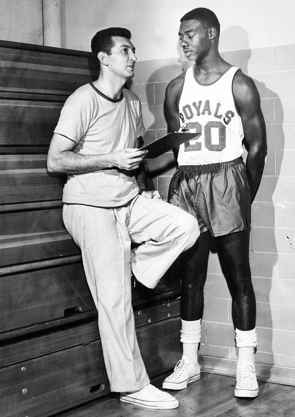 Charley Wolf, pictured here in 1960 with Oscar Robertson, coached the Cincinnati Royals and the Detroit Pistons. Wolf, a local legend who leaves behind a large family, died on Saturday, Nov. 26, 2022, at the age of 96.