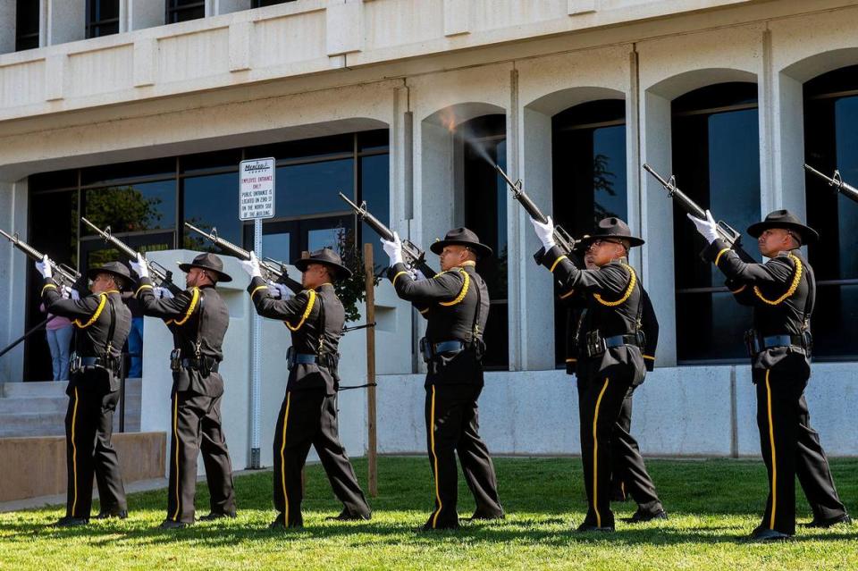 Officers perform a 21 gun salute during the annual Merced County Peace Officers Memorial ceremony in Merced, Calif., on Wednesday, May 18, 2022. The ceremony honors law enforcement officers who died in the line of duty.