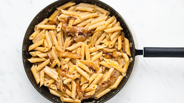 Pear and gorgonzola pasta in frying pan