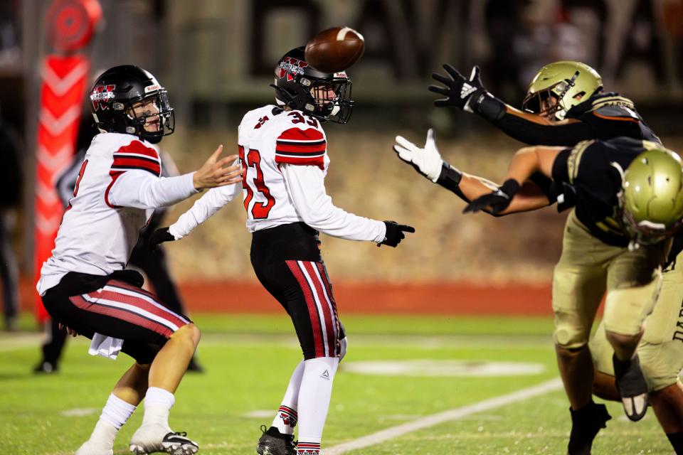 Weber High School’s Alex Johnson’s kick for the extra point is blocked and bounces back during the game against Davis High School in the second round of the Class 6A state tournament for high school football at Davis High School in Kaysville on Friday, Oct. 27, 2023. | Megan Nielsen, Deseret News