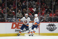 New York Islanders center Casey Cizikas, left, celebrates his goal with right wing Leo Komarov (47) during the second period of an NHL hockey game against the Washington Capitals, Tuesday, Dec. 31, 2019, in Washington. (AP Photo/Nick Wass)