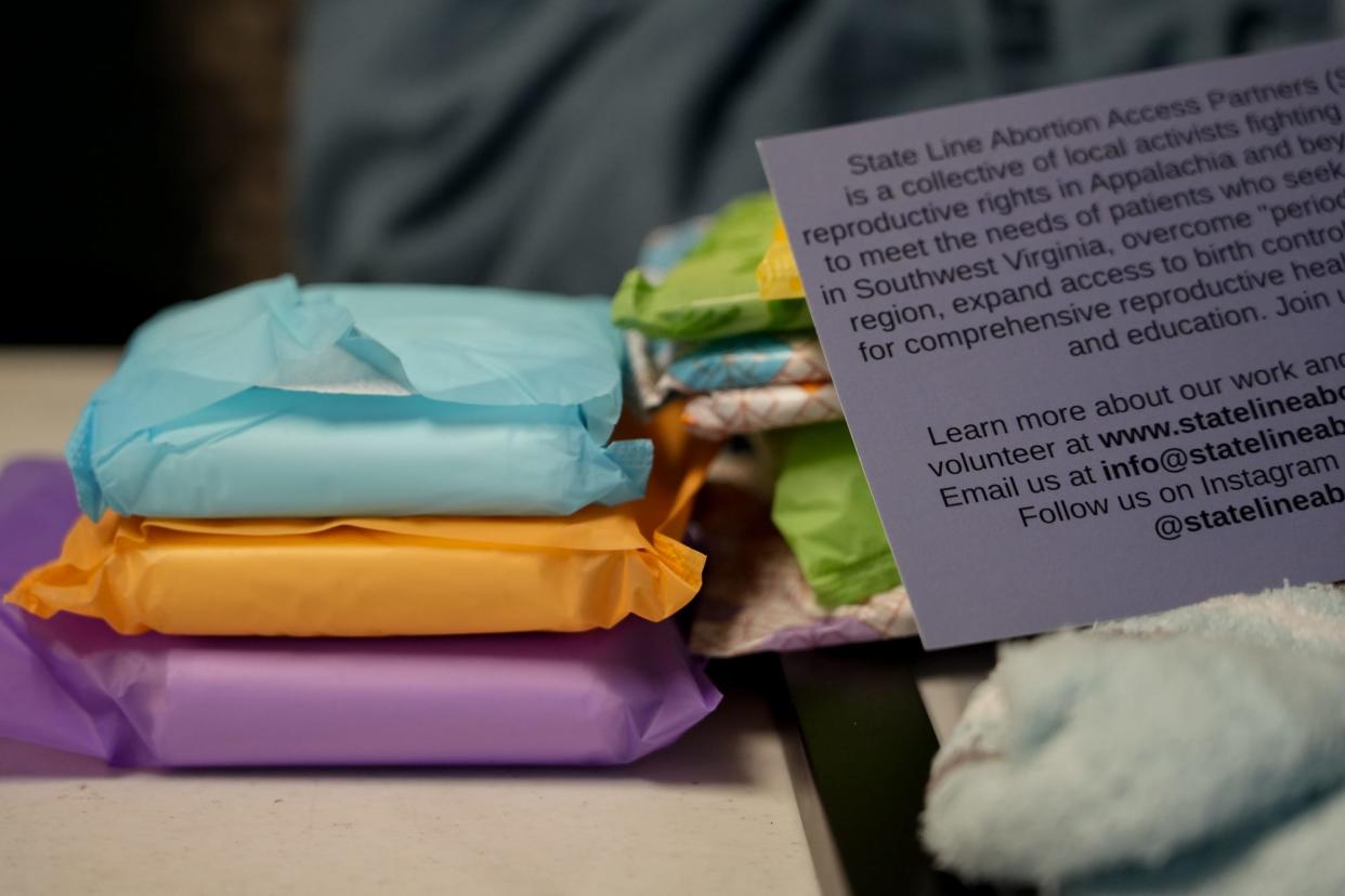 A patient care package from State Line Abortion Access Partners, or SLAAP, contains abortion aftercare items including menstrual pads and over-the-counter pain relievers.