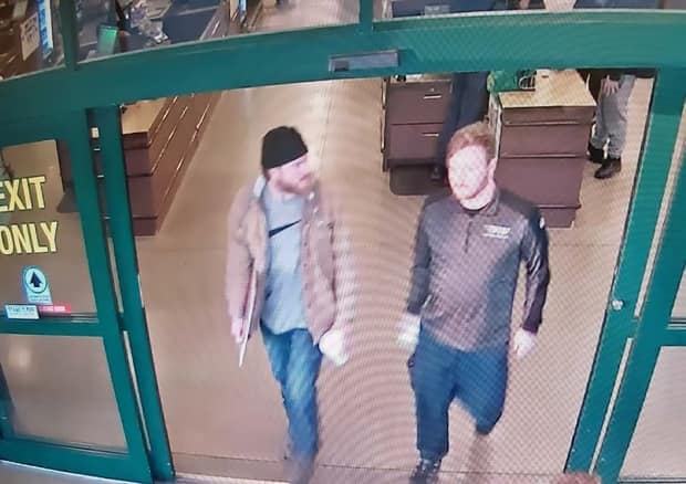 On Jan. 1, 2020, Patrik Mathews (left) and co-accused Brian Lemley went to a store in Delaware and bought approximately 150 rounds of 5.56 mm ammunition, as well as paper shooting targets. This is surveillance video from the store.