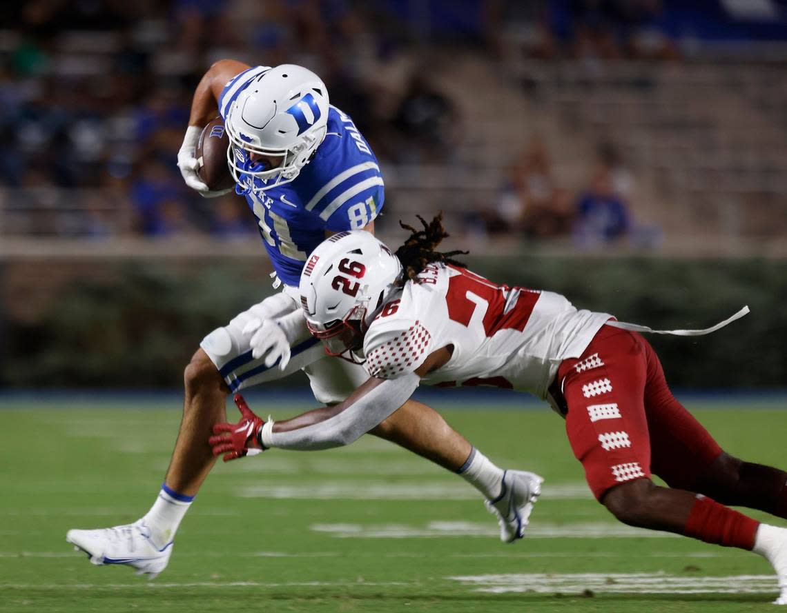 Duke tight end Nicky Dalmolin is tackled by Temple safety Brenyen Scott during the first half of the Blue Devils season opener at Wallace Wade Stadium on Friday, Sept. 2, 2022, in Durham, N.C.