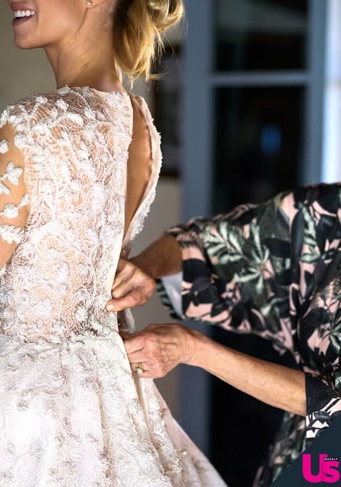 The back of Whitney's lace gown featured invisible buttons along the length of the design.