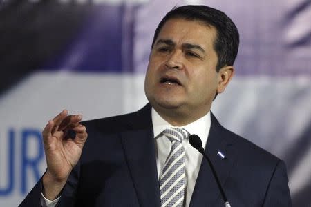 Honduras' President Juan Orlando Hernandez addresses the audience during a Conference on Unaccompanied Child Migrants in Tegucigalpa July 16, 2014. REUTERS/Jorge Cabrera