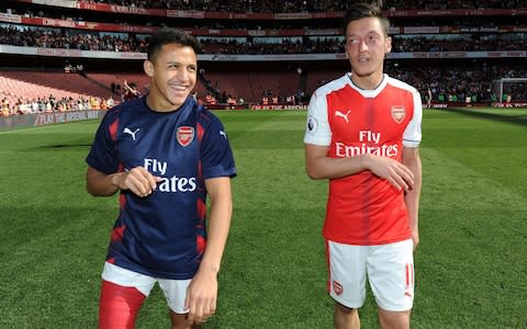 Alexis Sanchez (left) is wanted by Man City - Credit: GETTY IMAGES