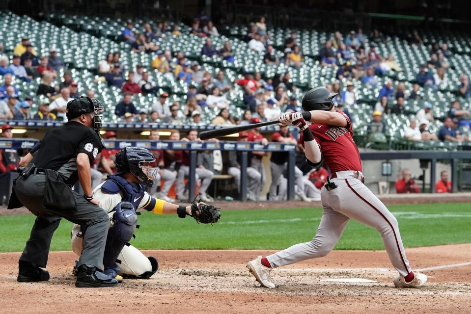 Arizona Diamondbacks' Josh Rojas hits a two-run home run during the ninth inning of a baseball game against the Milwaukee Brewers Wednesday, Oct. 5, 2022, in Milwaukee. (AP Photo/Morry Gash)