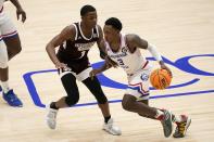 Mississippi State guard Iverson Molinar (1) defends as Louisiana Tech guard Amorie Archibald (3) handles the ball in the second half of an NCAA college basketball game in the semifinals of the NIT, Saturday, March 27, 2021, in Frisco, Texas. (AP Photo/Tony Gutierrez)