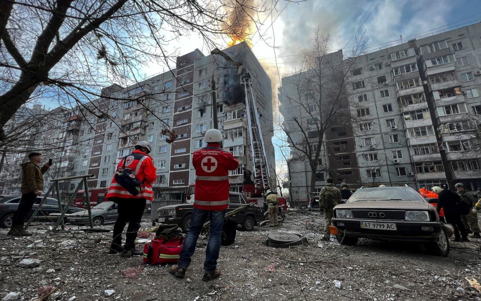 Paramedics and rescuers work at a site of a residential building damaged by a Russian missile strike - REUTERS/Sergiy Chalyi