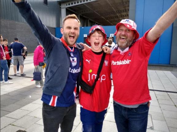 York Press: York City fans Simon Pickering, Olly Clarkson and Roy Clarkson celebrate promotion