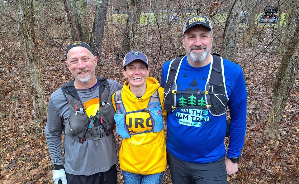 From left, Ray Guzic, Stephanie Daniels and Carl Leer get ready for a run on the trail around the Quemahoning Reservoir. They are training for the On The Dam Trail 50K run.