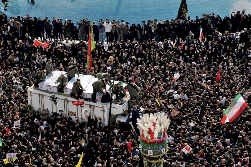 Coffins of Gen. Qassem Soleimani and others who were killed in Iraq by a U.S. drone strike, are carried on a truck surrounded by mourners during a funeral procession at the Enqelab-e-Eslami (Islamic Revolution) square in Tehran, Iran, Monday, Jan. 6, 2020. The processions mark the first time Iran honored a single man with a multi-city ceremony. Not even Ayatollah Ruhollah Khomeini, who founded the Islamic Republic, received such a processional with his death in 1989. Soleimani on Monday will lie in state at Tehran's famed Musalla mosque as the revolutionary leader did before him. (AP Photo/Ebrahim Noroozi)