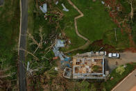 <p>The contents of a damaged home can be seen as recovery efforts continue following Hurricane Maria near the town of Comerio, Puerto Rico, Oct. 7, 2017. (Photo: Lucas Jackson/Reuters) </p>