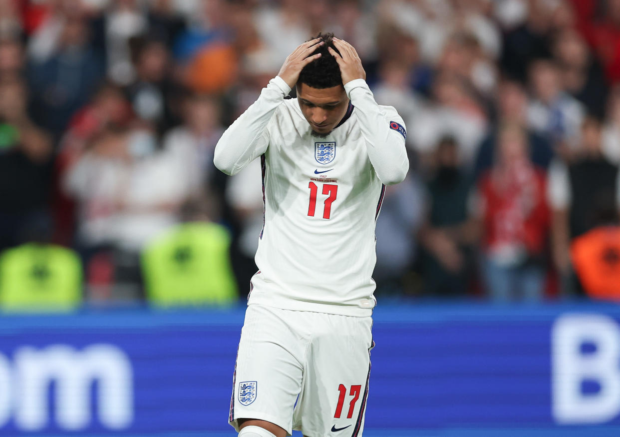LONDON, ENGLAND - JULY 11: Jadon Sancho of England looks dejected after missing their team's fourth penalty as it is saved during a penalty shoot out during the UEFA Euro 2020 Championship Final between Italy and England at Wembley Stadium on July 11, 2021 in London, England. (Photo by Eddie Keogh - The FA/The FA via Getty Images)