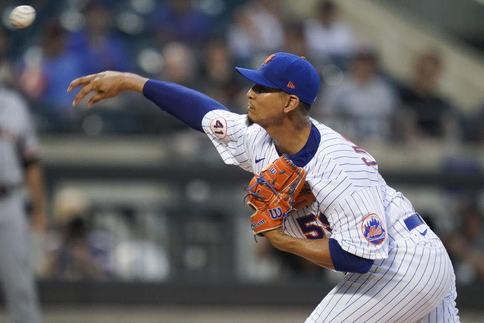 New York Mets' Carlos Carrasco delivers a pitch during the first inning of the team's baseball game against the San Francisco Giants on Thursday, Aug. 26, 2021, in New York. (AP Photo/Frank Franklin II)