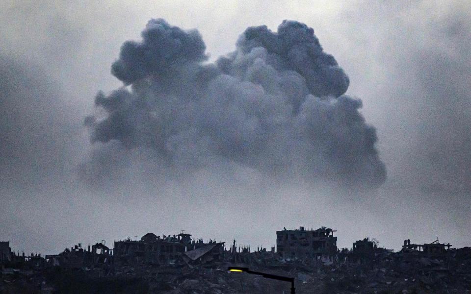 Smoke billowing after an Israeli strike on northern Gaza