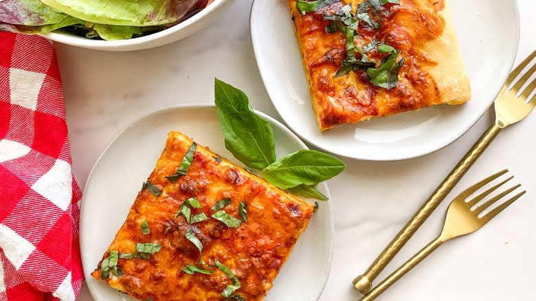 Sicilian pizza squares on plates